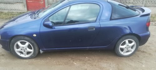 AMORTIZOR CU ARC SI FLANSA DREAPTA FATA OPEL TIGRA FAB. 1994 – 2000 ⭐⭐⭐⭐⭐