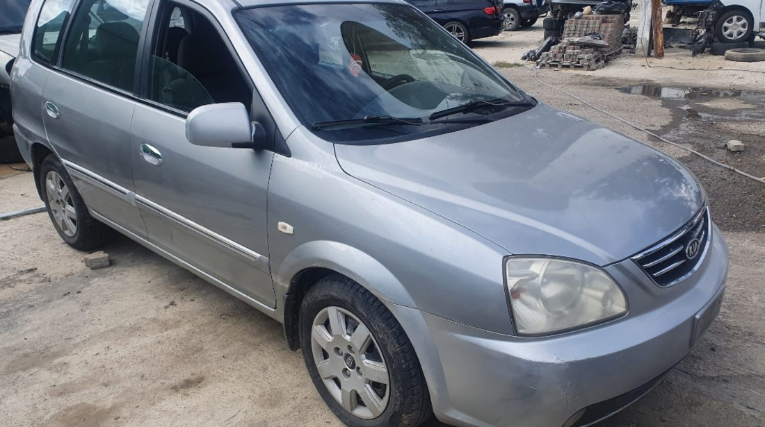 Aripa stanga spate Kia Carens 2004 break 2.0 crdi