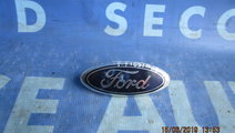 Emblema Ford Fiesta 2004;  2S61A425A52AA (spate)