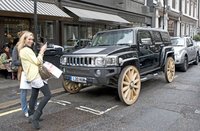 Click image for larger version

Name:	Hummer H3 Gets Wagon Wheels1.jpg
Views:	284
Size:	359.0 KB
ID:	700884